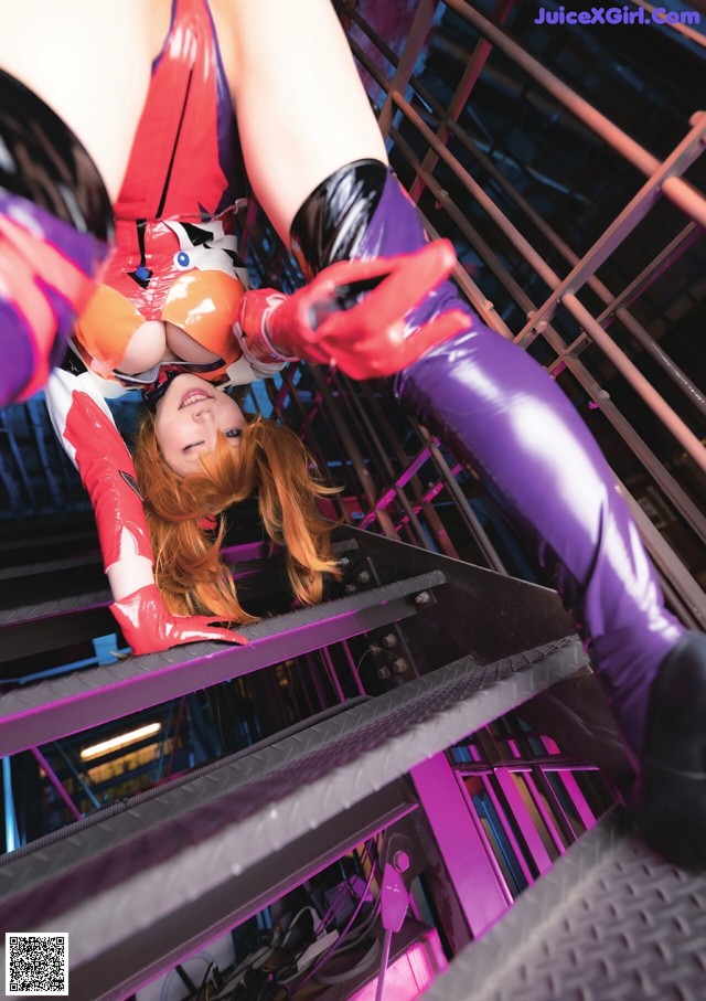 A woman in a latex outfit is climbing up a ladder.