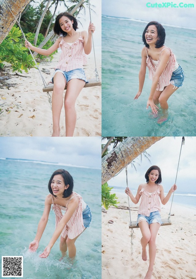 A woman sitting on a swing in the water.