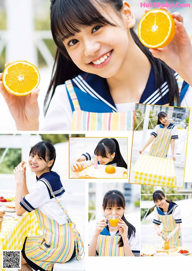 A woman in an apron holding an orange in her hand.